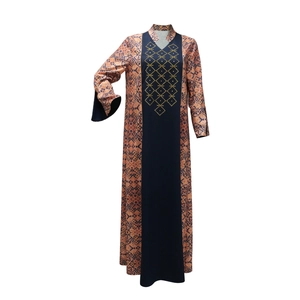 Detail of Middle Eastern Abaya with ethnic print panels and gold geometric embroidery