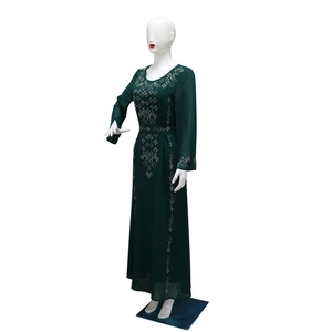 Detailed embroidery and rhinestone patterns on dark green long sleeve maxi dress
