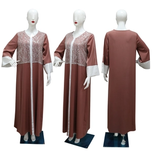 Detail of satin maxi dress with sequins embroidery and contrast stitching on sleeves