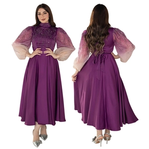 Close-up of purple gradient puff sleeves with sequins and intricate bodice embroidery