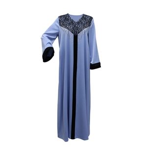 Detail of light blue Abaya with black lace neckline and radiant silver rhinestones