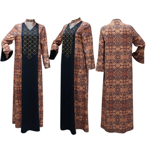 Detail of ethnic print abaya featuring golden diamond mesh embroidery and flared sleeves
