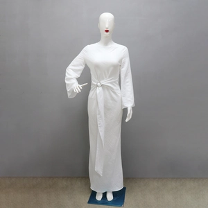 Detailed macro view of white maxi dress waist featuring elegant metal ring buckle and tie