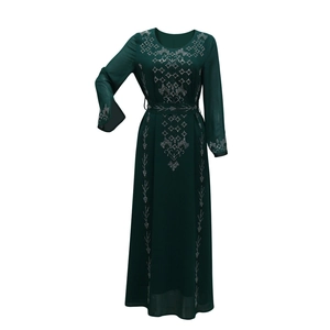 Detailed silver star rhinestone patterns on dark green long sleeve abaya dress