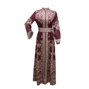Detail of dark purple Jalabiya ethnic dress with white patterns and zipped mandarin collar