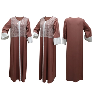 Detail view of V-neck satin abaya dress with contrast stitching and sequin embroidery