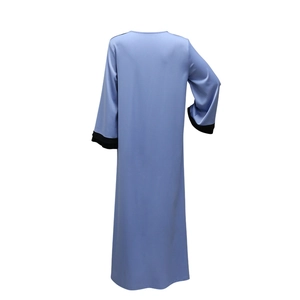 Back view of a light blue long sleeve maxi dress featuring black contrast cuffs detail