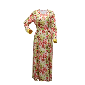 Detailed view of lightweight floral chiffon maxi dress with V-neck and yellow trim accents