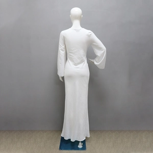 Detailed back view of white minimalist floor-length dress with slim fit long sleeves
