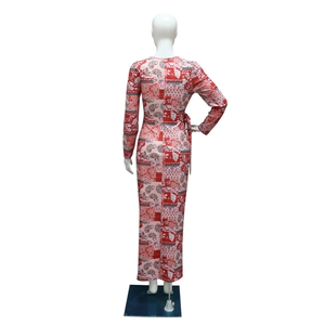 Detail view of back bodice on long sleeve paisley print dress with waist tie ribbon