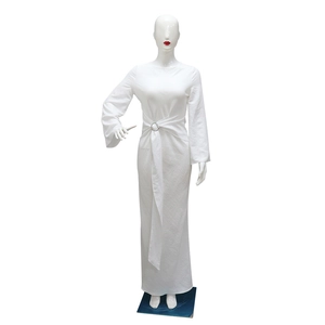 Detail view of white maxi dress featuring waist metal ring buckle and pleated ribbon design