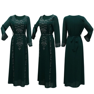 Detailed views of dark green long-sleeved Abaya dress with silver rhinestone patterns