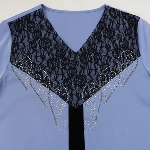 Detail of light blue dress with black rose lace appliques and silver rhinestones