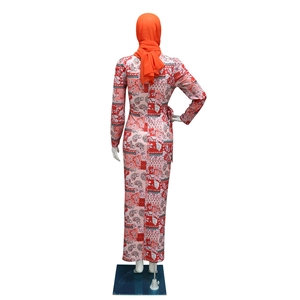Rear view of floral long sleeve maxi dress featuring vibrant patterns and orange hijab
