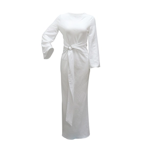 Detail showing elegant white maxi dress with waist metal ring and draped ribbon