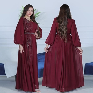 Deep burgundy evening gown with rhinestones, lantern sleeves, and flowing flared skirt
