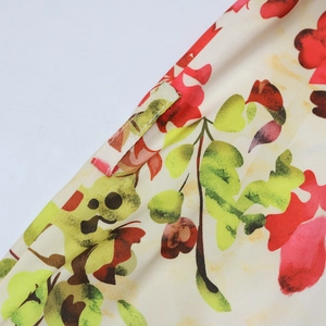 Close-up of floral print dress fabric featuring neat stitching and a sturdy belt loop