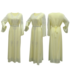 Detailed views of light yellow chiffon maxi dress with silver rhinestones and waist tie