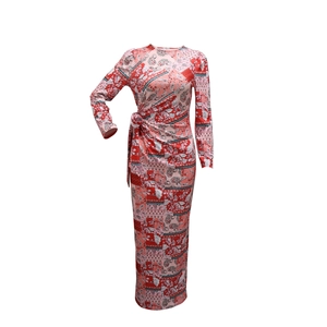 Detailed view of paisley print on long sleeve dress with waist knot detail