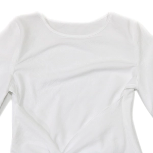Close-up of white crew neck top featuring elegant gathered pleats and lightweight fabric