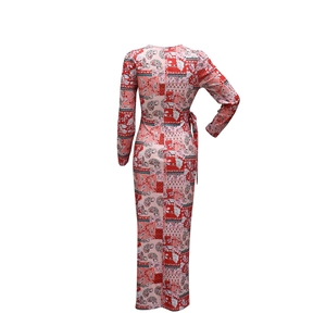 Detailed back view of paisley printed long sleeve dress with waist tie details