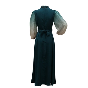 Back view of jalabiya gown with puff sleeves and gradient rhinestone detailing