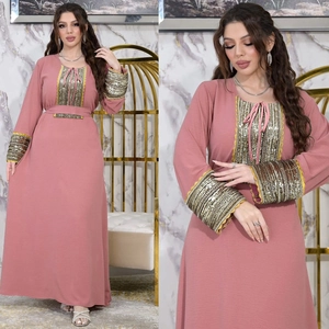 Detail of jalabiya evening dress with sequin cuffs and lace neck tie in dusty rose