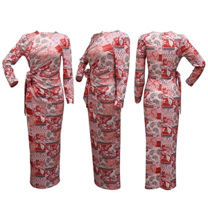 Detail of long sleeve ankle-length paisley print dress with waist tie and pleated design
