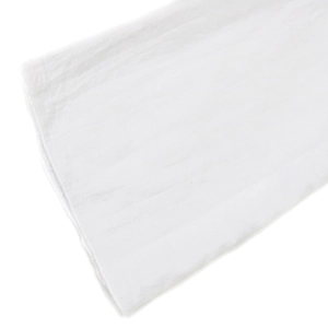 Detailed macro shot of pure white cotton fabric with fine stitching and natural texture