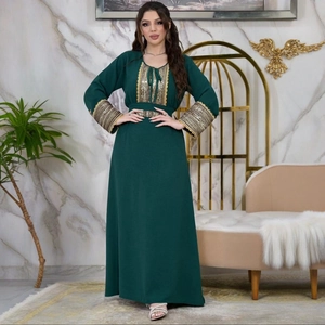 Dark green jalabiya evening dress with gold sequins embroidery and elegant belt