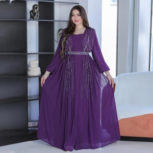 Detailed close-up of vertical sequin tassels on high-waist purple evening gown