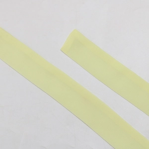 Detailed view of soft light yellow chiffon fabric straps for elegant dress trim and DIY