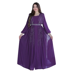 Detail of silver bead embroidery and sequins on the purple long-sleeved evening gown
