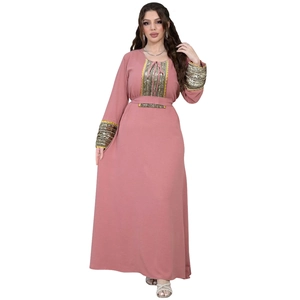 Detail of sequins lace trim and tie neckline on pink Jalabiya evening dress gown