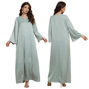 Elegant sage green satin abaya with silver rhinestone vine patterns and flared sleeves