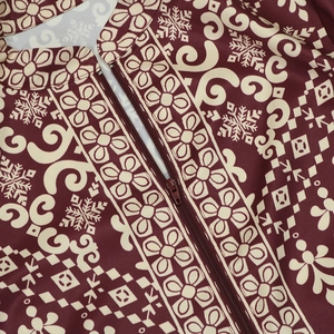 Macro detail of wine red jalabiya dress with white floral prints and front resin zipper