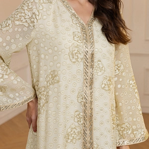 Elegant champagne kaftan dress with jacquard floral embroidery and gold sequin trim detail