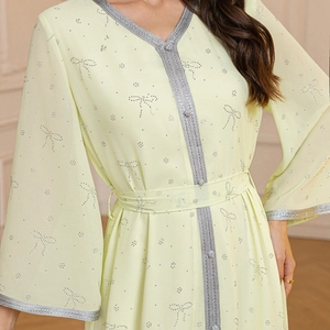 Elegant lime chiffon kaftan dress with V-neck, silver braided trim and rhinestone bow detail