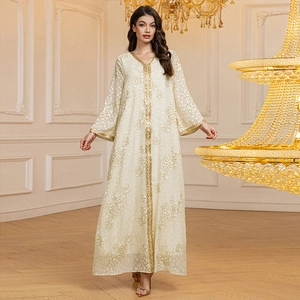 Detailed view of cream kaftan with intricate gold floral jacquard and sequin trim