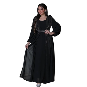 Detail of elegant black abaya gown with silver rhinestone tassels and long lantern sleeves