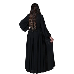 Detailed back view of a black evening gown featuring rhinestone accents and lantern sleeves