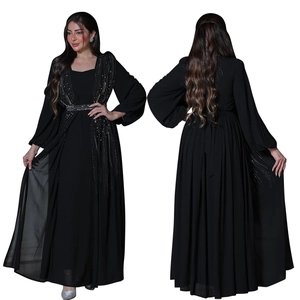 Detail of long sleeve black abaya with sparkling rhinestone sequins and cinched waist belt
