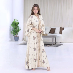Elegant beige kaftan with ethnic embroidery and gold sequin trim details