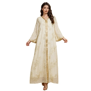 Close-up of golden braided ribbon trim on ivory jacquard floral chiffon abaya robe