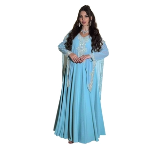 Detail of light blue chiffon gown with silver sequin embroidery on V-neck and sleeves