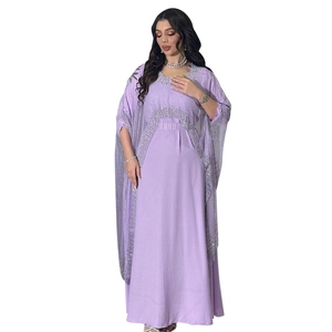 Detail of silver sequin embroidery on light purple kaftan dress with tulle cape