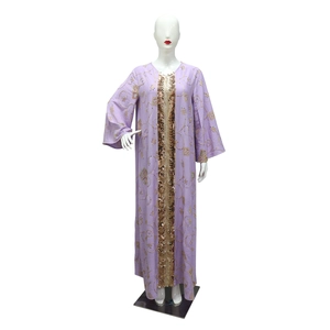 Detail of lavender kaftan featuring gold sequin trim and intricate floral embroidery