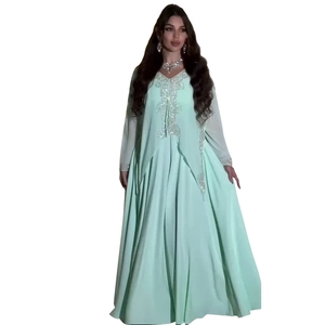 Detail of mint green chiffon kaftan dress with intricate silver rhinestone embroidery