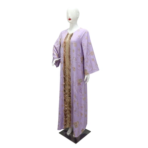 Detail of light purple abaya featuring intricate gold spiral embroidery and sequin trim