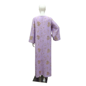 Detail view of ethnic embroidery and sequins on back of light purple kaftan dress
